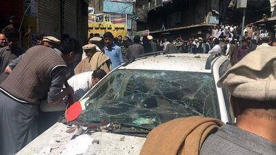 Pakistani residents gather at the site of an explosion at a market in Parachinar, capital of the Kurram tribal district. Twenty-two people were killed and 57 wounded in the bombing claimed by the Taliban. AFP
