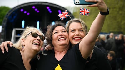 Women take selfies at The Big Lunch in Windsor. Getty Images