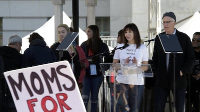 Actor Ted Danson, right, and his wife Mary Steenburgen address demonstrators during the Women's March in downtown Los Angeles. Mike Nelson / EPA