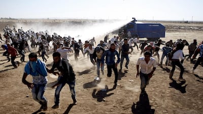 But television reports said said the Kurds claimed they wanted to take aid into Syria. Ulas Yunus Tosun/EPA