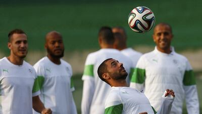 Algeria players attend a training session ahead of their match against Russia at the Major Antonio Couto Pereira stadium in Curitiba on June 25, 2014. Amr Abdallah Dalsh / Reuters