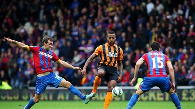 Tom Huddlestone of Hull City battles for the ball with James McArthur, left, and Mile Jedinak of Crystal Palace during their Premier League match on Saturday in Hull. Jan Kruger / Getty Images