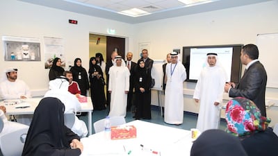 Officials from the National Qualifications Authority and the Abu Dhabi Education Council issued mock examinations to teachers as part of the TELS UAE Pilot Project last November. The pilot paves the way for introducing the country's first national teacher licensing system. Courtesy ADEC