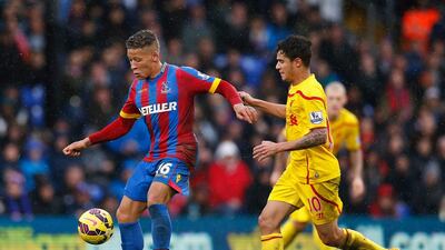 Dwight Gayle of Crystal Palace is closed down by Philippe Coutinho of Liverpool during the Barclays Premier League match between Crystal Palace and Liverpool at Selhurst Park on November 23, 2014 in London, England. Steve Bardens/Getty Images