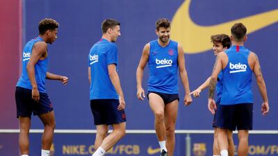Barcelona defender Gerard Pique, third right, controls the ball. Reuters