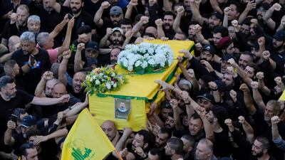 Mourners carry the coffin of senior Hezbollah commander Yasser Nemr Qranbish, who was killed by an Israeli air strike in Syria near the border with Lebanon, at his funeral in Beirut. AP
