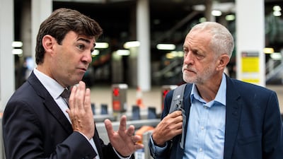Labour leader Jeremy Corbyn is greeted by Mr Burnham as he arrives at Manchester Victoria Station in 2018