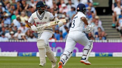 India's Ajinkya Rahane and India's Cheteshwar Pujara run between the wickets.