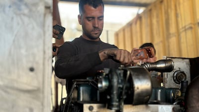 A worker repairs equipment at Nasser Medical Complex in Khan Younis in the southern Gaza Strip, as hospital officials say shortages of fuel and spare parts needed to operate the facility's generators are leading to a crisis. AFP