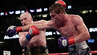 Saul Alvarez, right, connects with a right-hook during his points victory against Matthew Hatton for vacant WBC light-middleweight belt.