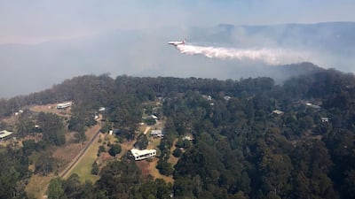 A firefighting 737 jet water bombing a fire at Binna Burra, some 100km south of Brisbane. AFP