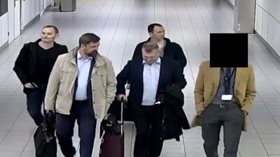 Four Russian officers of the Main Directorate of the General Staff of the Armed Forces of the Russian Federation, GRU, are escorted to their flight after being expelled from the Netherlands on April 13, 2018.(Dutch Defense Ministry via AP)