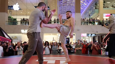 Merab Dvalishvili takes part in an open workout.
