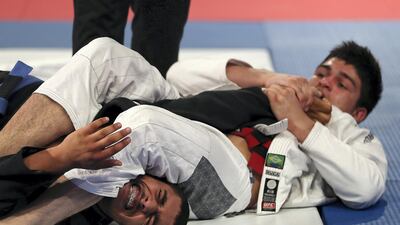Murafis Ismailov, right, takes on Sultan Khamis Alameri in the 81kg final.