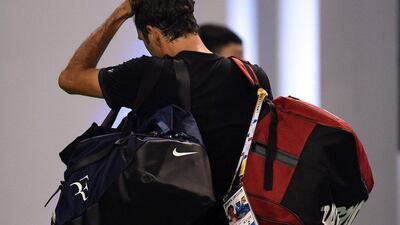 Roger Federer leaves the court after losing to Albert Ramos in the second round of the Shanghai Masters on Tuesday. Johannes Eisele / AFP / October 13, 2015