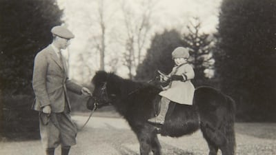 Britain’s Queen Elizabeth II with the Duke of York on Shetland pony, Peggy in 1930. The Royal Collection / AP photo
