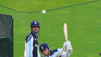 Alastair Cook looks on as batsman Alex Hales trains during a practice session. Stu Forster / Getty Images