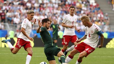 Mathew Leckie of Australia is tackled by Simon Kjaer of Denmark. Robert Cianflone / Getty Images
