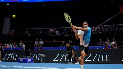 Felix Auger-Aliassime of Kites, returns the ball to Dominic Thiem of Hawks. AP