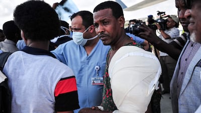 Medical staff escort a Somali wounded in a truck bomb attack in Mogadishu before transporting him for treatment. Mohammed Abdiwahab / AFP