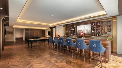 The mansion's basement boasts a private cinema and a games room, with a cigar lounge and bar. Courtesy Luxhabitat Sotheby's International Realty