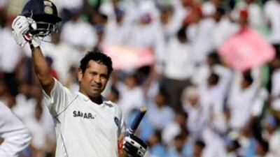 Sachin Tendulkar celebrates on becoming the leading run-scorer in Test Match Cricket history during the first day of the second Test match between India and Australia in Mohali on Oct 17 2008.