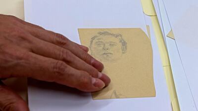 One of the surprises in the collection is a notebook filled with sketches and doodles, which was kept in a Swiss bank vault for years. AFP