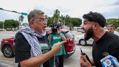 A pro-Palestinian activist, left, argues with an Israel supporter during a rally in Miami, Florida in support of Palestinians in Gaza. AP