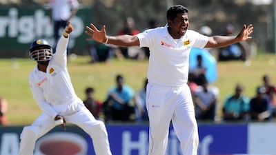 Rangana Herath, right, usually among the wickets against Pakistan, was ineffective during the Galle Test. Ishara Kodikara / AFP