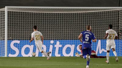 Marco Asensio, left, scores the second goal, AP
