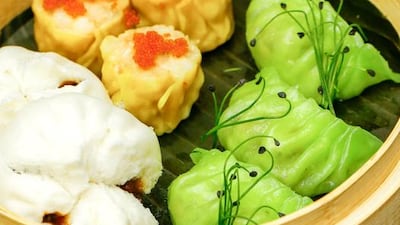 Chicken prawn siomai, summer truffle beef bun, vegetable dumplings with pea sprouts. Victor Besa for The National