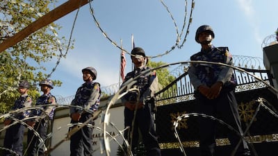 Police secure the Malaysian embassy as a group of Myanmar Buddhist monks stage a protest in Yangon on December 3, 2016 to denounce Malaysia's Prime Minister Najib Razak's support for the persecuted Muslim Rohingya minority. Malaysia accused Myanmar of engaging in the "ethnic cleansing" of its Rohingya minority on December 3, as former UN chief Kofi Annan visited a burned out village in strife-torn Rakhine state. Romeo Gacad / AFP
