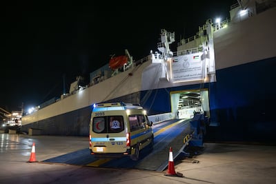 An ambulance takes patients on board the floating hospital. Wam