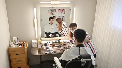 Blitzers member Hong Seung-hyun having his make-up done at a beauty salon in Seoul ahead of a promotional shoot. AFP