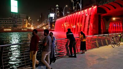 Residents watch the light show in Business Bay. AP