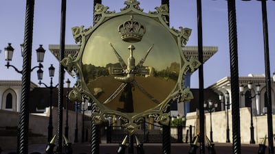 The royal seal on the entrance gates to the Al Alam Palace in Muscat, a residence of Sultan Qaboos of Oman. The Arab Gulf nation on May 27, 2018 extend a ban on hiring foreigners in the private sector by six months. Christopher Pike / Bloomberg