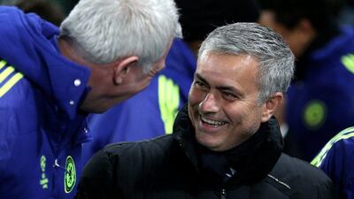 Chelsea manager Jose Mourinho talks with a member of staff during his side's Champions League victory against Sporting Lisbon on Wednesday. Clive Mason / Getty Images / December 10, 2014