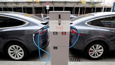 Tesla Model X electric cars at a recharging point in Berlin. Reuters
