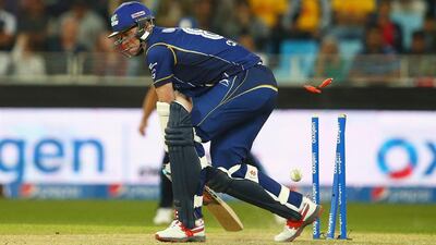 DUBAI, UNITED ARAB EMIRATES - JANUARY 29: Rikki Clarke of Capricorn Commanders is bowled by Fidel Edwards of Leo Lions during the Oxigen Masters Champions League 2016 match between Capricorn Commanders and Leo Lions at Dubai International Cricket Stadium on January 29, 2016 in Dubai, United Arab Emirates. (Photo by Francois Nel/Getty Images)