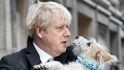 Boris Johnson outside Methodist Hall polling station as he casts his vote with dog Dilyn, in December 2019. Getty Images