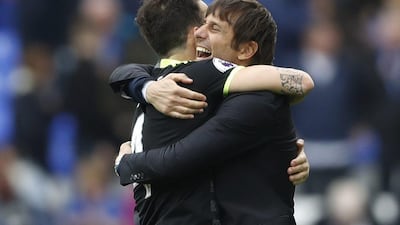 Chelsea manager Antonio Conte celebrates after the match with Cesc Fabregas. Carl Recine / Reuters