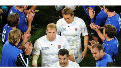 England's disappointed players leave the field after their quarter-final defeat to France on Saturday.