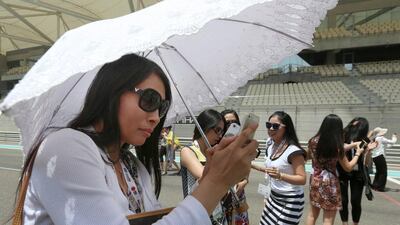 Delegates of the Chinese Visitor Summit tour the Yas Marina circuit on Yas Island. Delores Johnson / The National