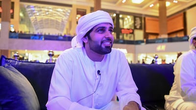 Emirati Saif Al Belooshi takes in the action. Khushnum Bhandari / The National