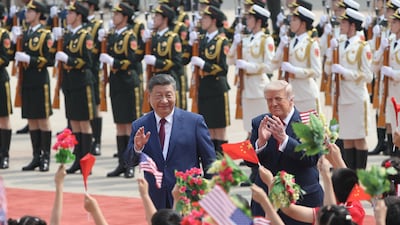 Xi Jinping and Donald Trump at a welcome ceremony at the Great Hall of the People in Beijing. Reuters