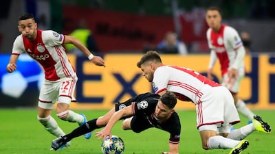 Chelsea midfielder Jorginho is challenged by Ajax players during the Champions League game at the Amsterdam ArenA. AP Photo