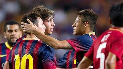 Barcelona’s Lionel Messi, left, and Neymar, second to the right, celebrate after scoring against Thailand during an exhibition match last week. Nicolas Asfouri / AFP