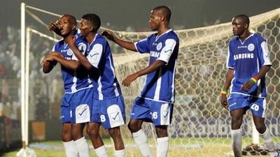 Teammates celebrate with Edward Sadomba (left) after his goal for Al Hilal against al-Ahly.
