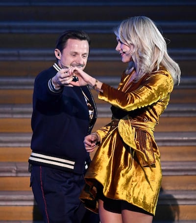 Olympique Lyonnais' Norwegian forward Ada Hegerberg (R) dances with French DJ and producer Martin Solveig after receiving the 2018 Women's Ballon d'Or