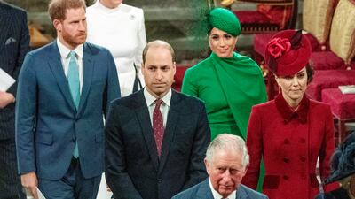 Prince Harry and Meghan walk behind Prince William and Kate, with King Charles at Westminster Abbey in London. AP